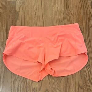 lululemon speed up shorts in bright orange/coral